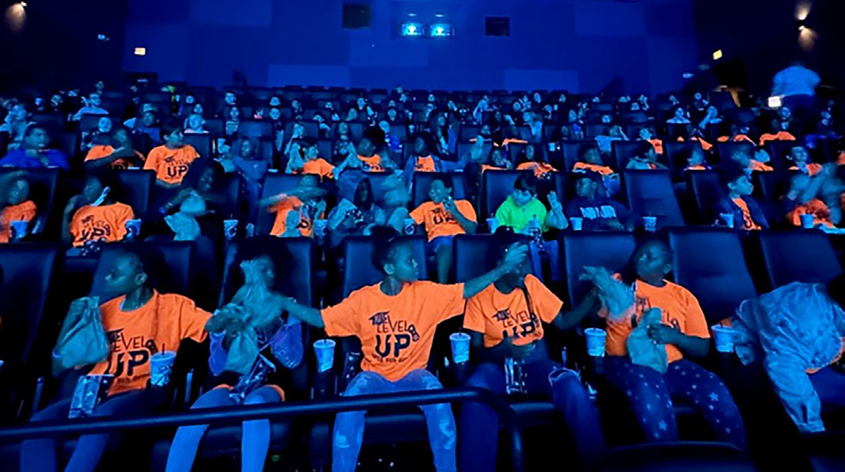 Fifth grade students from Sabal Palm Elementary School in the IMAX theater at the Challenger Learning Center